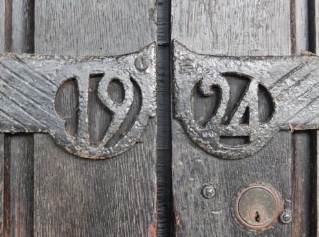 All Saints Church wrought-iron date on porch door