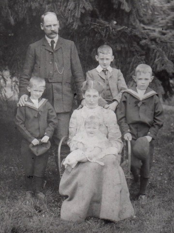 The Gibbons family, William.G. standing, John H is the eldest son, standing to the right of his father in a 3 piece suit