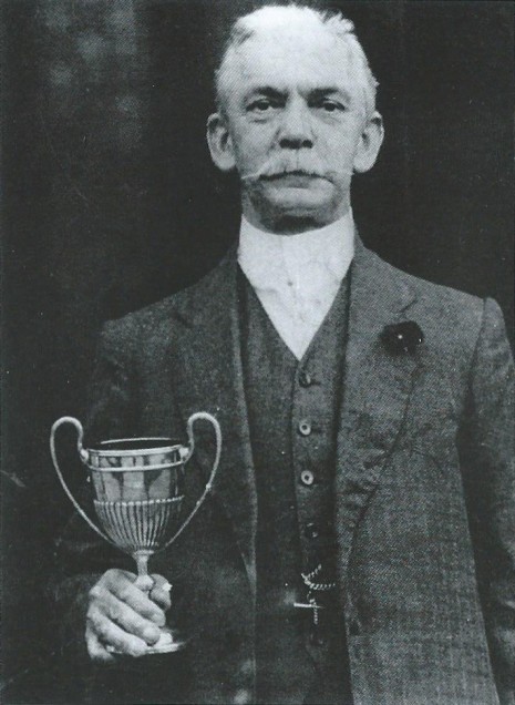 Thomas Glossop holding the Abbeydale Amateur Gardening Society Cup
